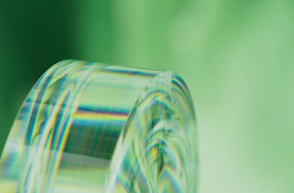 a close up of a roll of tape on a green background